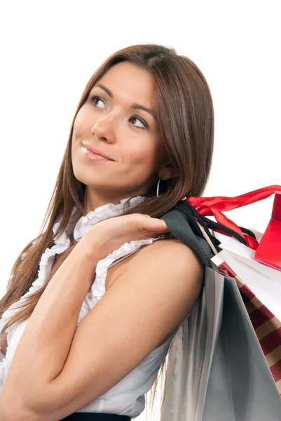 Woman holding shopping gift bags in hand — Stock Photo, Image