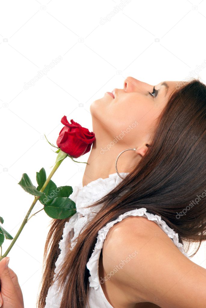 Young woman holding rose in hand