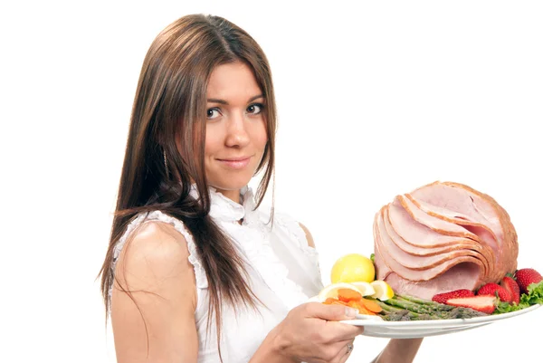 Woman hold plate baked honey sliced ham — Stock Photo, Image