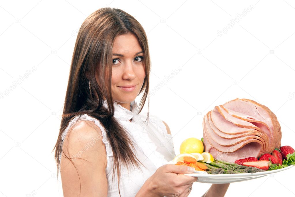 Woman hold plate baked honey sliced ham