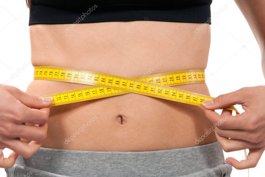 Athletic fit slim female measuring waist