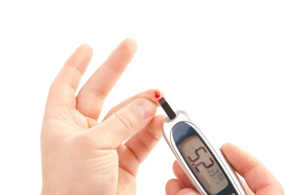 Диабет измеряет уровень глюкозы в крови — стоковое фото