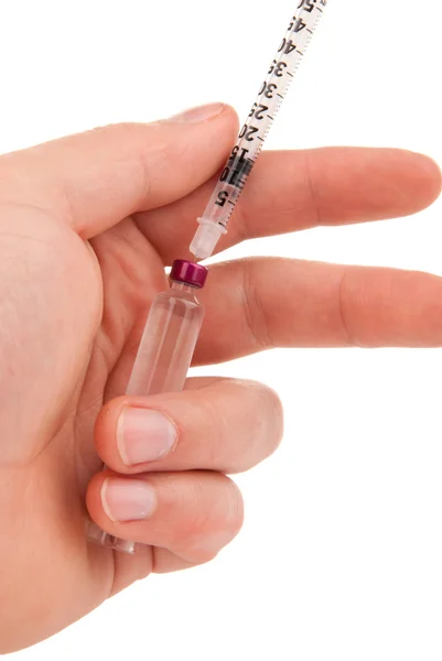 Diabetic hand with medical syringe and ampoule — Stock Photo, Image
