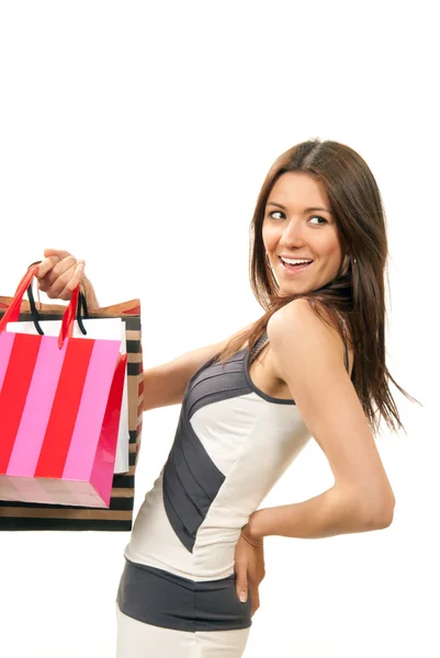 Mujer de pie, con tarjeta de crédito y bolsas de compras en la mano —  Fotos de Stock