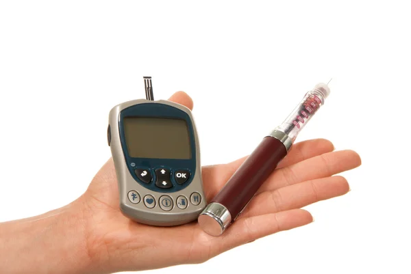 Diabetes hand with insulin syringe injector glucometer — Stock Photo, Image