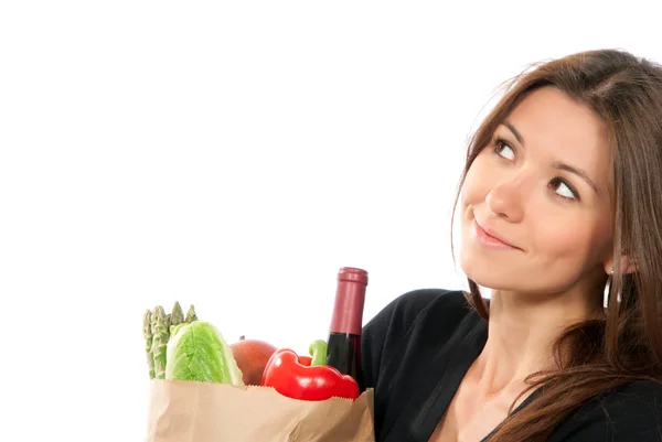 Mujer sosteniendo una bolsa llena de comestibles vegetarianos —  Fotos de Stock
