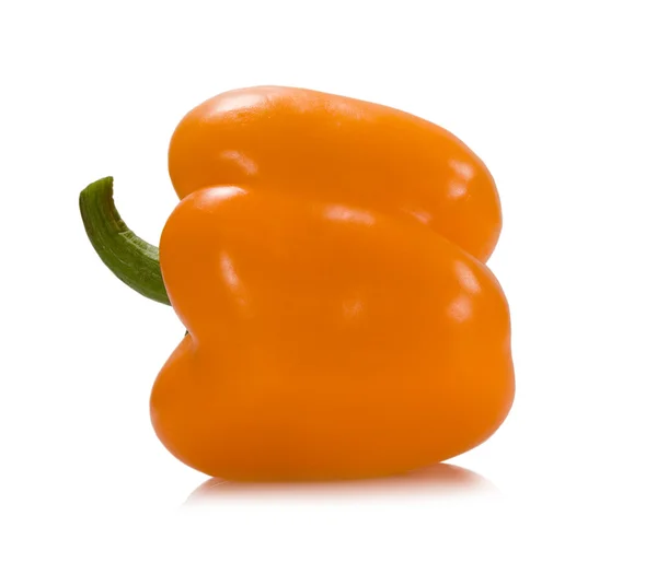 Oranje peper met een groene stok — Stockfoto