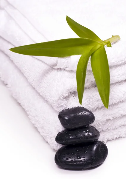 Towels and pebbles, water droplets on it. — Stock Photo, Image