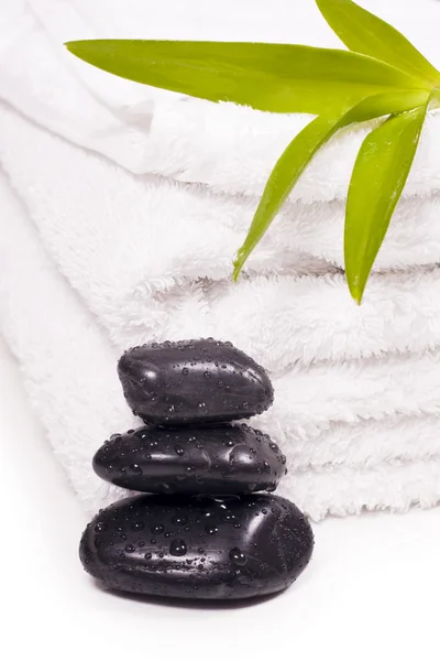 Towels and pebbles, water droplets on it. — Stock Photo, Image