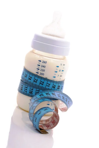 Baby bottles, tape wound around. — Stock Photo, Image