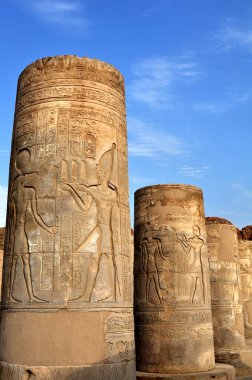 Temple columns in Egypt against the sky clipart