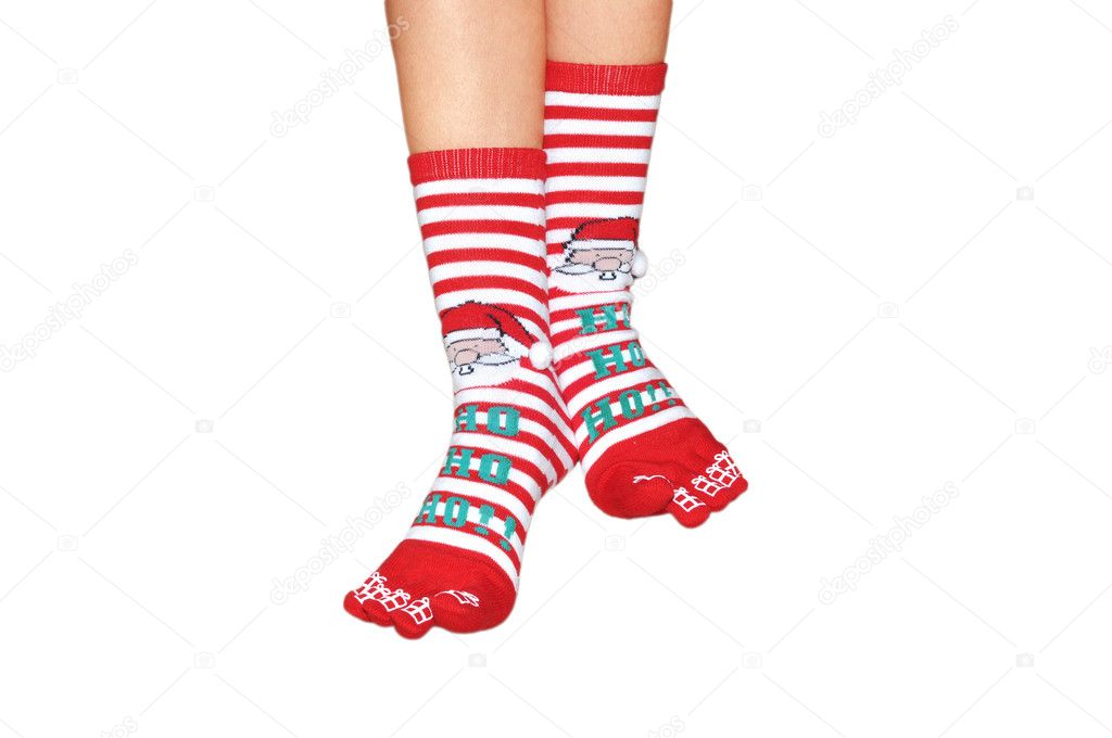 Feet of the girl in Christmas socks