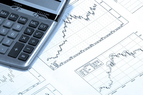 Calculator and finance charts. — Stock Photo, Image