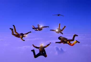 Sportsmen-parashutist soaring in sky clipart