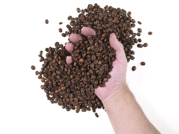 Håndfuld kaffebønner - Stock-foto