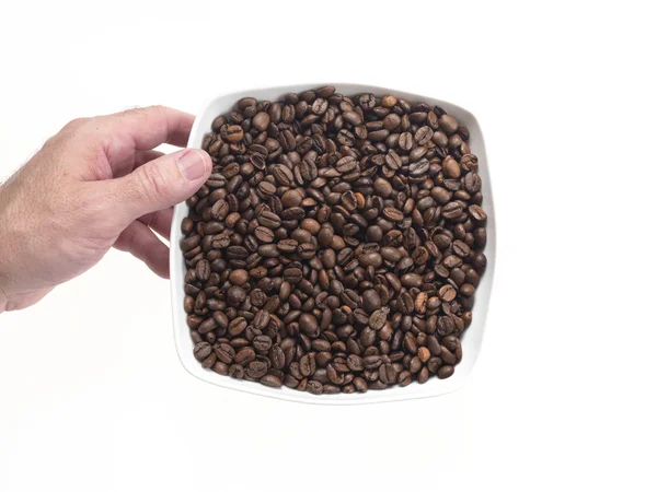 Plato lleno de granos de café —  Fotos de Stock