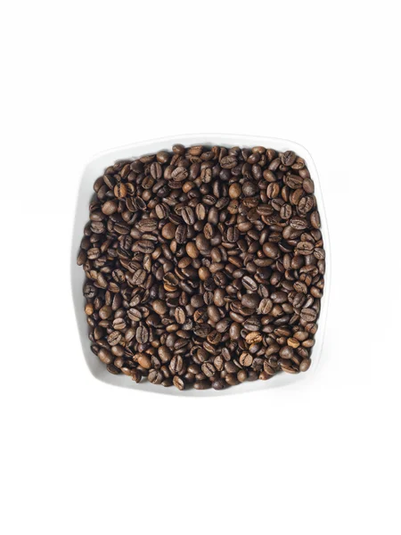 Plato lleno de granos de café —  Fotos de Stock