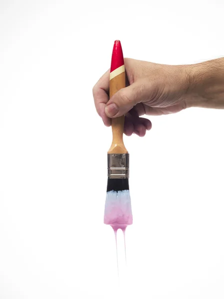 El ve damlayan boya fırçası — Stok fotoğraf