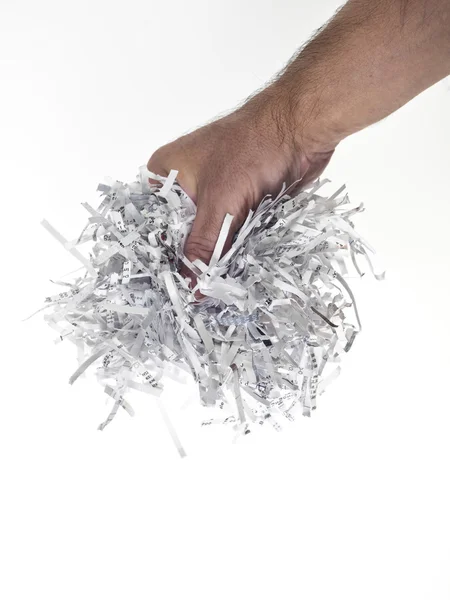 stock image Hand of man with heap of paper strips