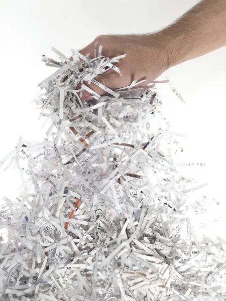 stock image Hand of man with heap of paper strips