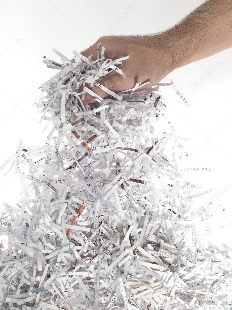 Hand of man with heap of paper strips