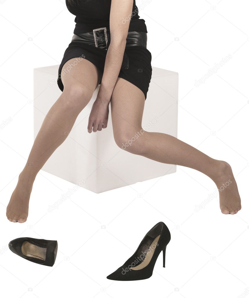 Sexy legs of sitting woman