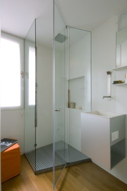 Shower cubicle with glass partition clipart