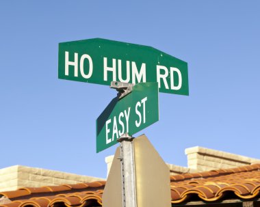 A road intersection in Carefree Arizona showing how to live a Ho Hum life on Easy Street. clipart