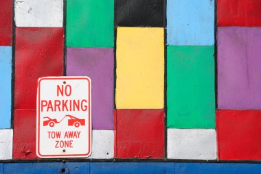 Colorful Wall with No Parking Sign clipart