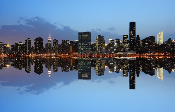 The Lower Manhattan Skyline with serious reflections in New York City.