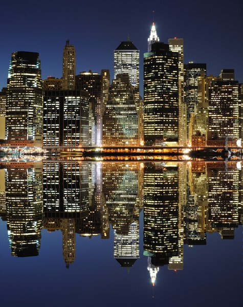 The Lower Manhattan Skyline with serious reflections in New York City.