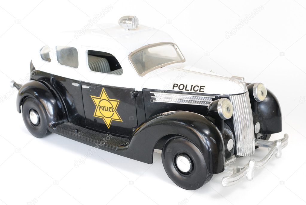 Vintage miniature police car isolated.