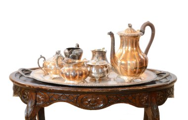 An antique Morroccan tea set on a nice table clipart