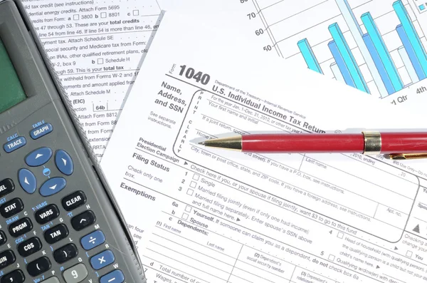 Paperwork Including 1040 Calculating Taxes — Stock Photo, Image