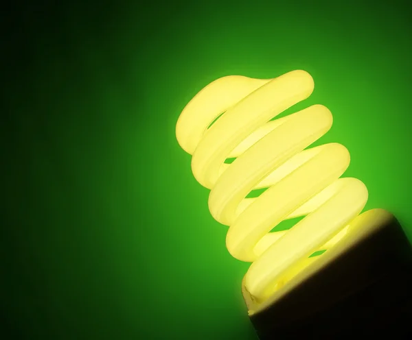 stock image Yellow fluorescent lamp on green background