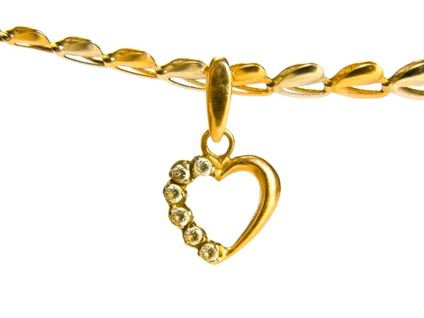 Stock image Gold heart-shaped pendant on a chain of white and yellow gold