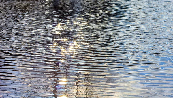 Sunbeams in the river water — Stock Photo, Image