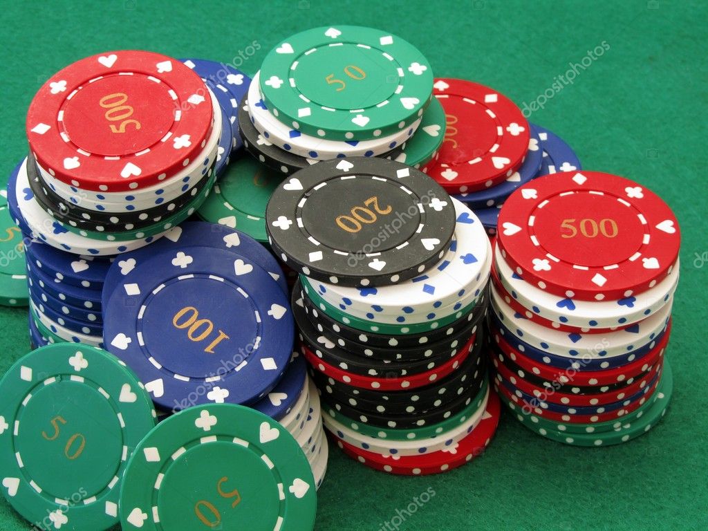 Poker chips on green felt poker table Stock Photo by ©gcpics 4347541