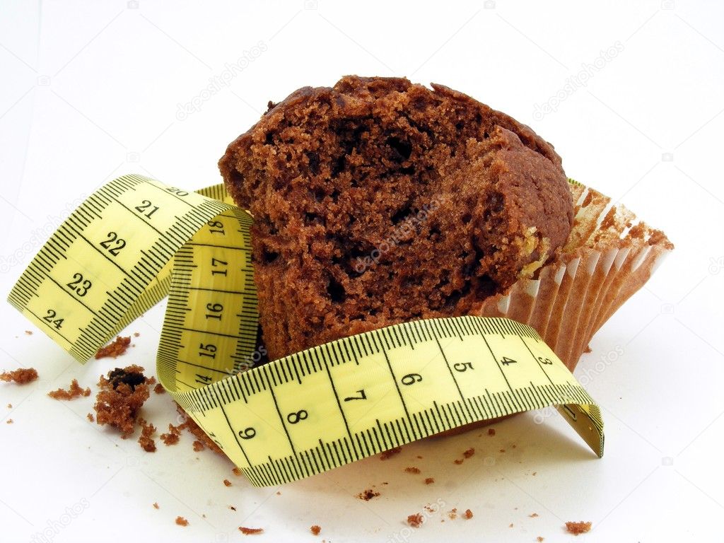 Chocolate muffin with measuring tape