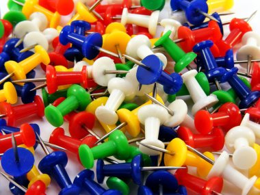 Coloured thumbtacks close up clipart