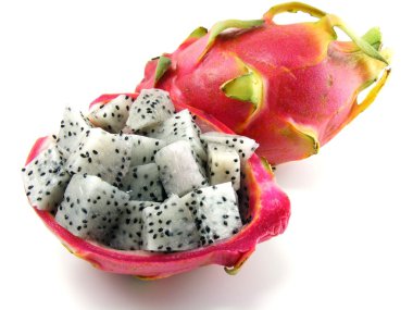 Diced dragon fruit pieces in the shell next to a whole fruit clipart