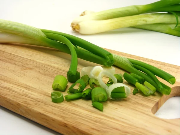 Spring Onions Wooden Chopping Board — Stock Photo, Image