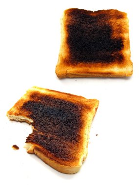 2 images of burnt toast on a white background clipart