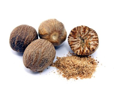 Selection of whole & grated nutmeg on white background clipart