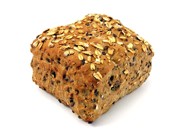 Um pão integral com grãos — Fotografia de Stock
