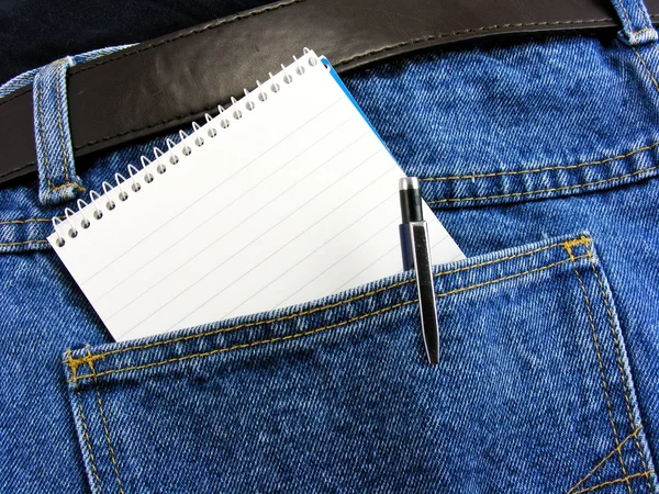 stock image Workmans note book in back pocket with copy space