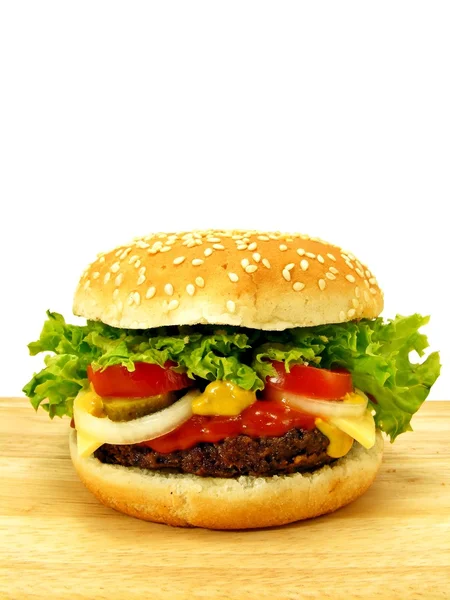 Cheeseburger on wooden board — Stock fotografie