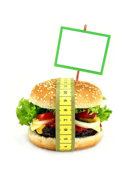 Un cheeseburger avec ruban à mesurer & espace de copie — Photo