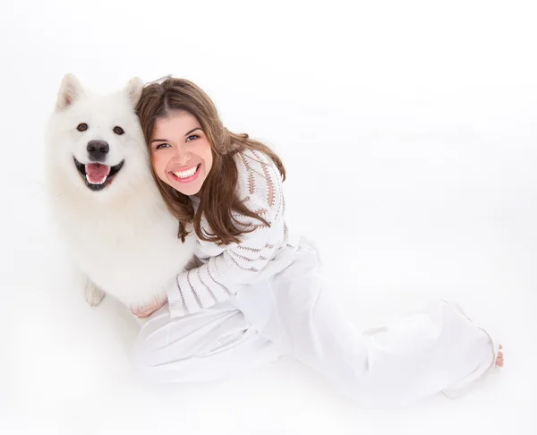 Woman with white dog, smiling — Stock Photo © shotsstudio #4371331