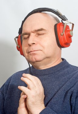 Man with headphones listening to music clipart